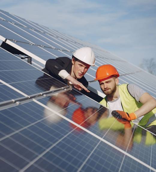 Foreman and businessman at solar energy station.